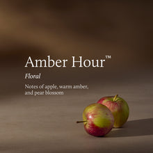 Two apples on a brown background with 'Amber Hour' branding and description.