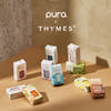 Collection of Thymes products on a brown surface with 'pura' branding.