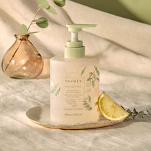 Eucalyptus Nourishing Body Cleanser on dish with slice of fruit
