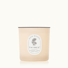 Thymes candle with a label on a white background