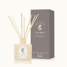 Thymes Noir Woods fragrance diffuser with packaging on a white background