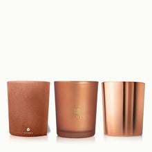 Three Thymes candles in different finishes on a white background