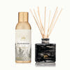 Thymes Noir Woods home fragrance mist and diffuser on a white background