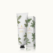 Hand cream tube and packaging with frasier fir design on a white background