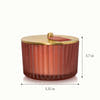 A 3 wick candle in a frosted ribbed glass with a height of 3.7 inches and a diameter of 5.15 inches