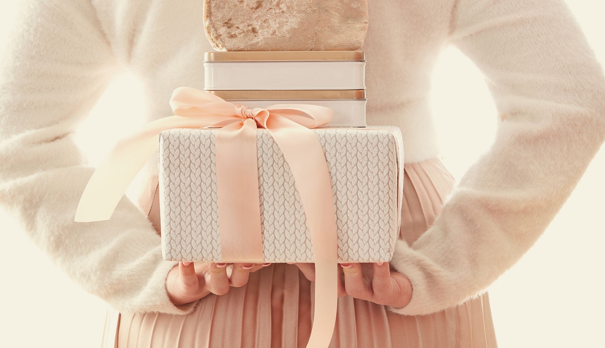 Woman holding wrapped gifts