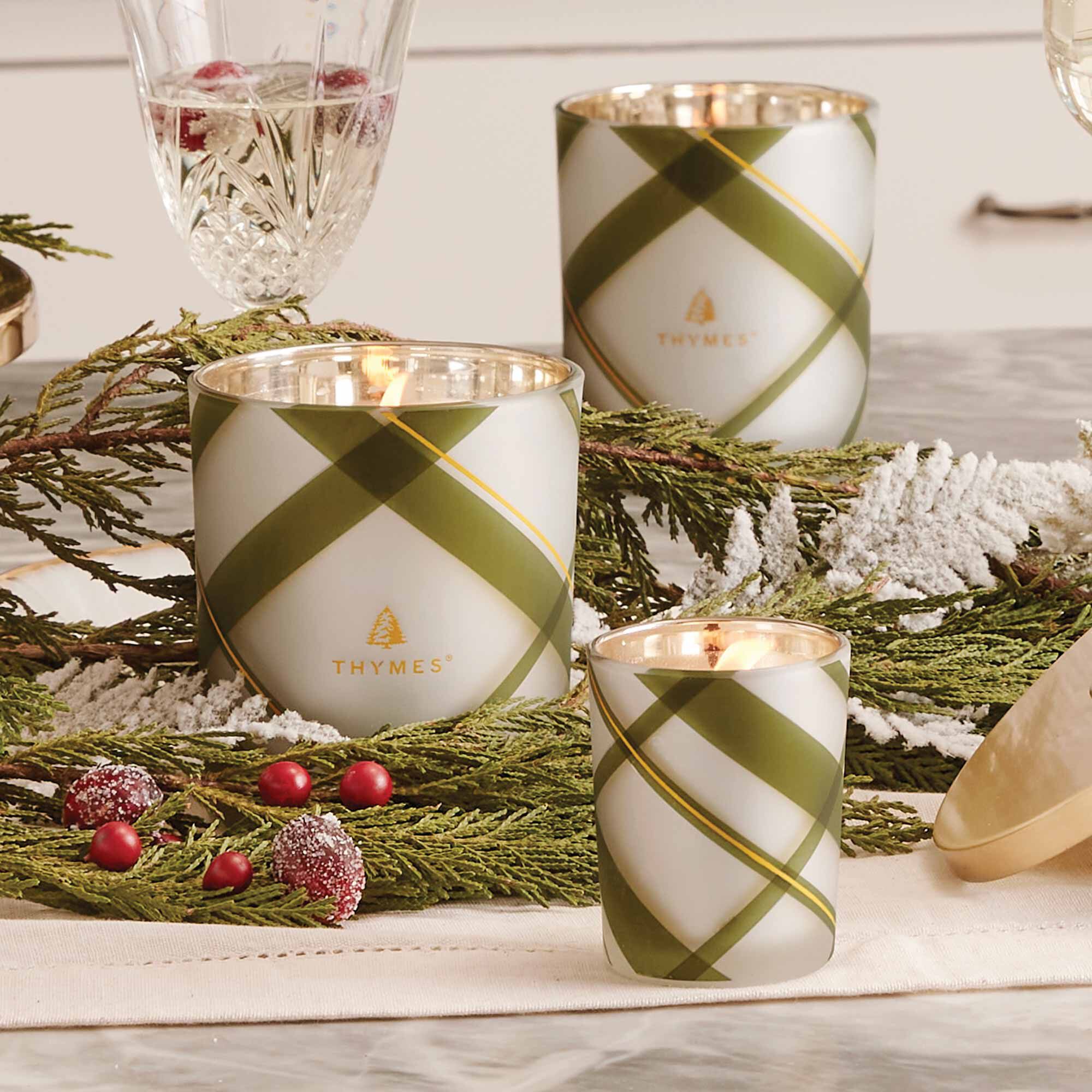 Three different sizes of Frasier Fir Frosted Plaid candles by Thymes