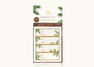 A present wrapped in Thymes Frasier Fir scented wrapping paper