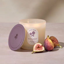 Thymes candle with figs on a neutral background