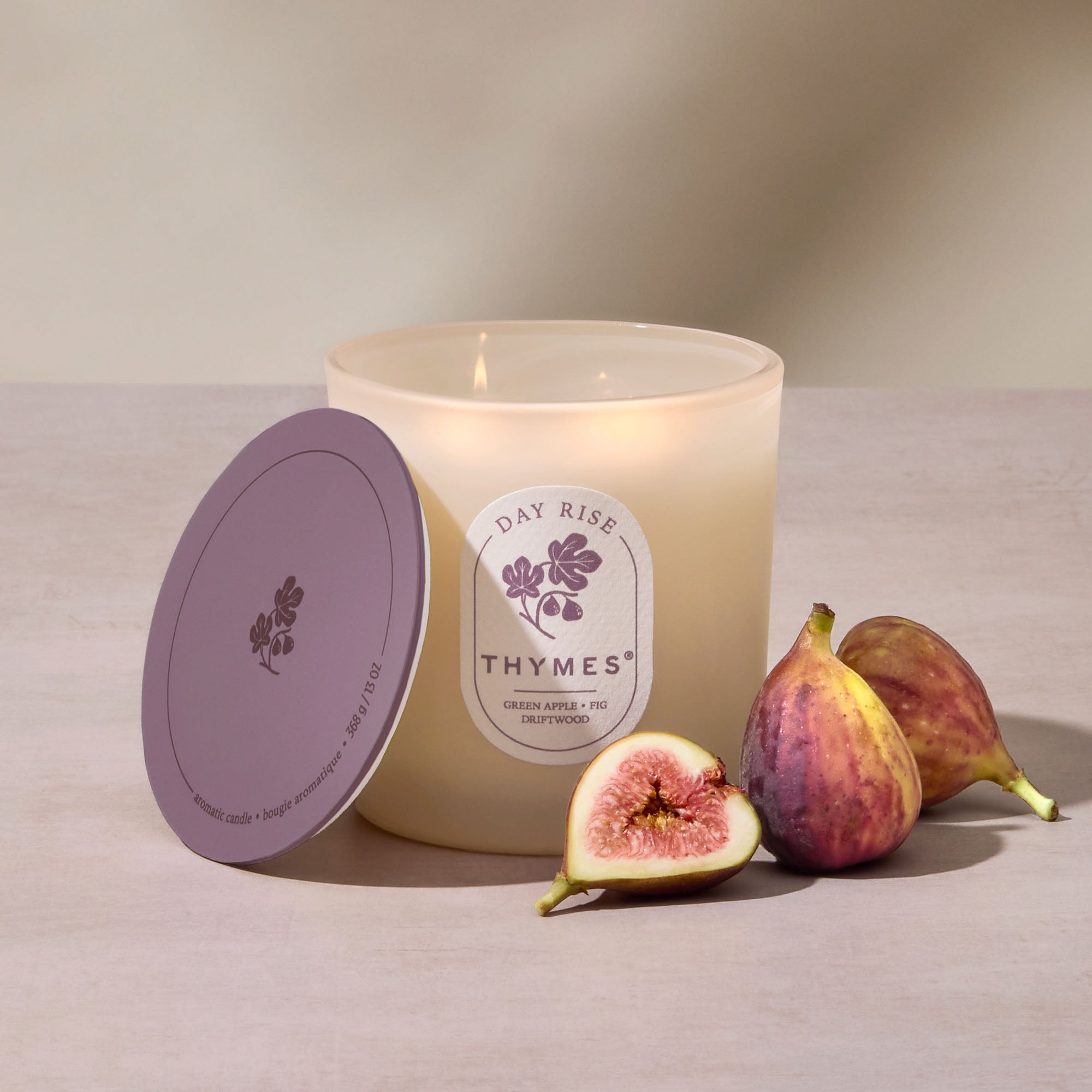 Thymes candle with figs on a neutral background