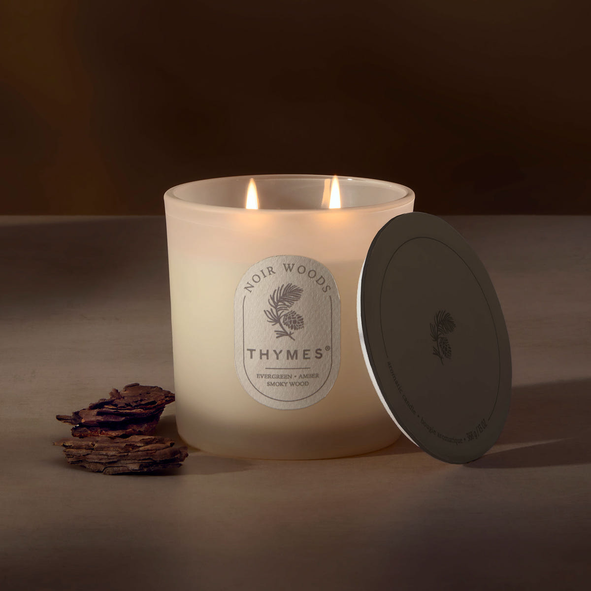 Alternate image of Thymes candle with a label on a brown background