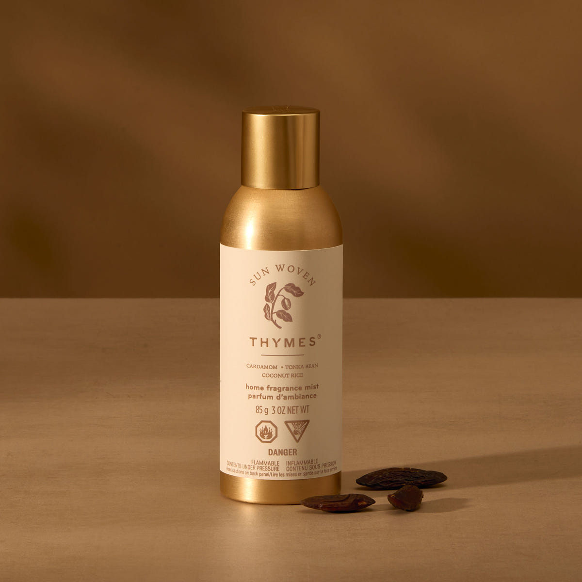Alternate image of Thymes product with gold cap and label on a brown background