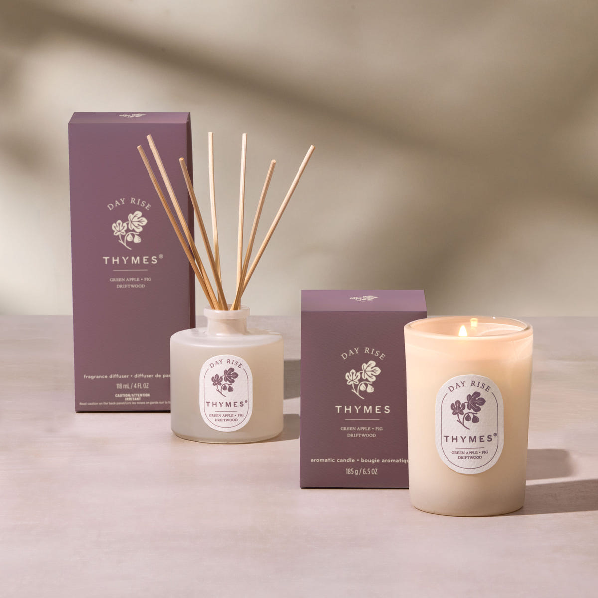 Alternate image of Thymes Day Rise candle and diffuser set on a neutral background