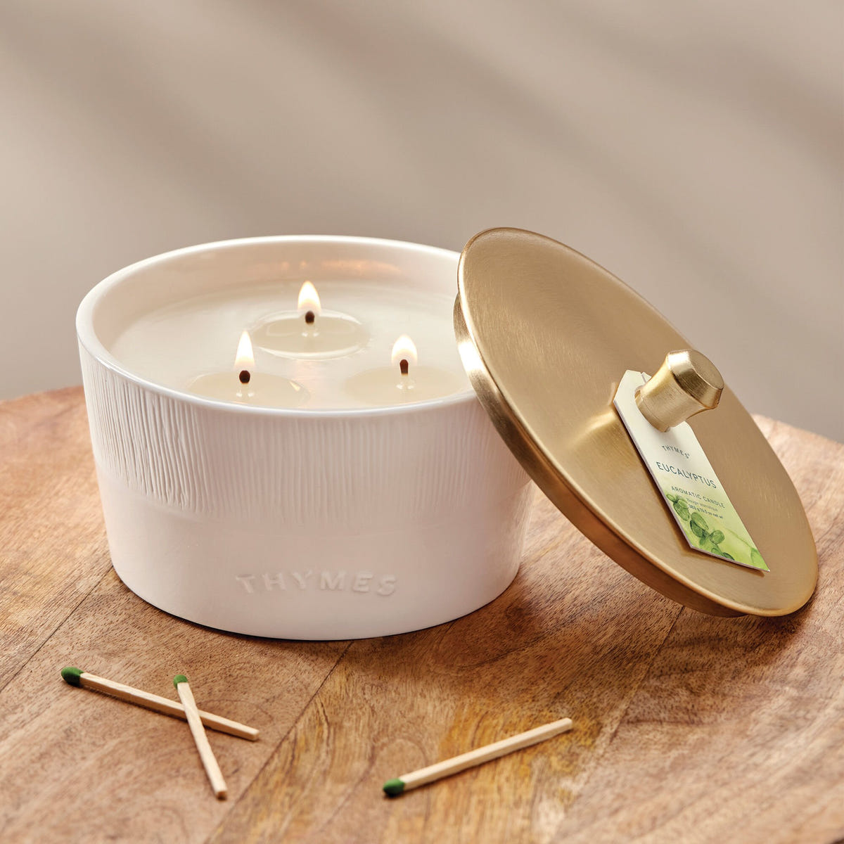 Alternate image of Thymes Eucalyptus 3-Wick Candle on table