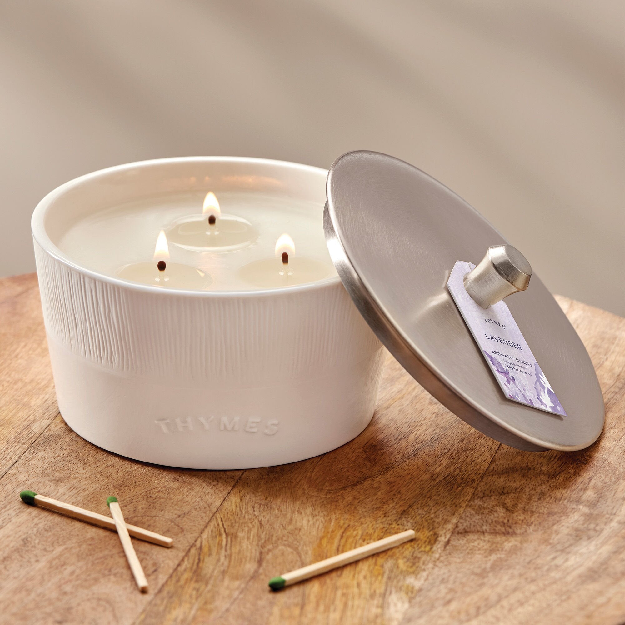 Thymes Lavender 3-Wick Candle on table