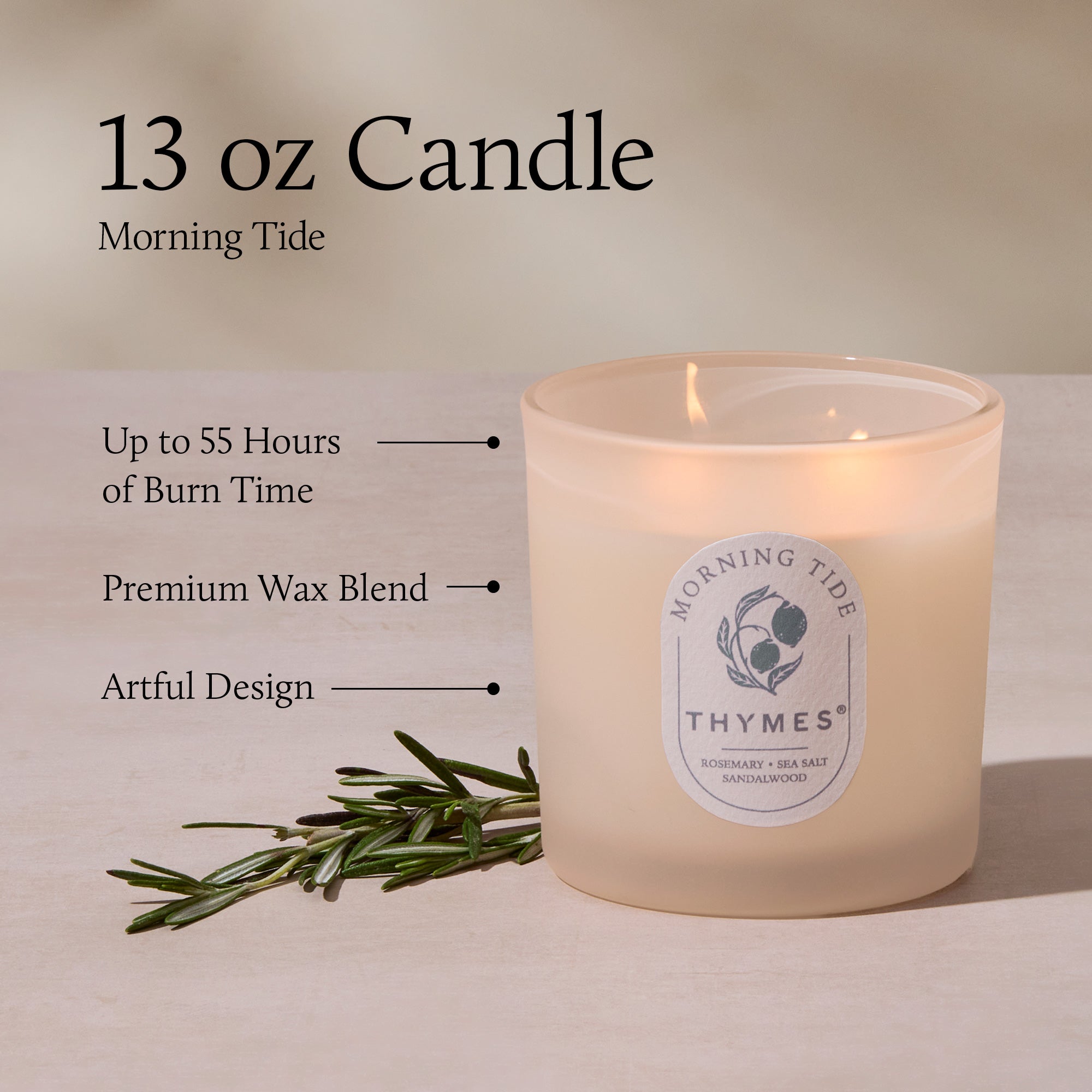 Thymes candle with label and rosemary branch on a neutral background