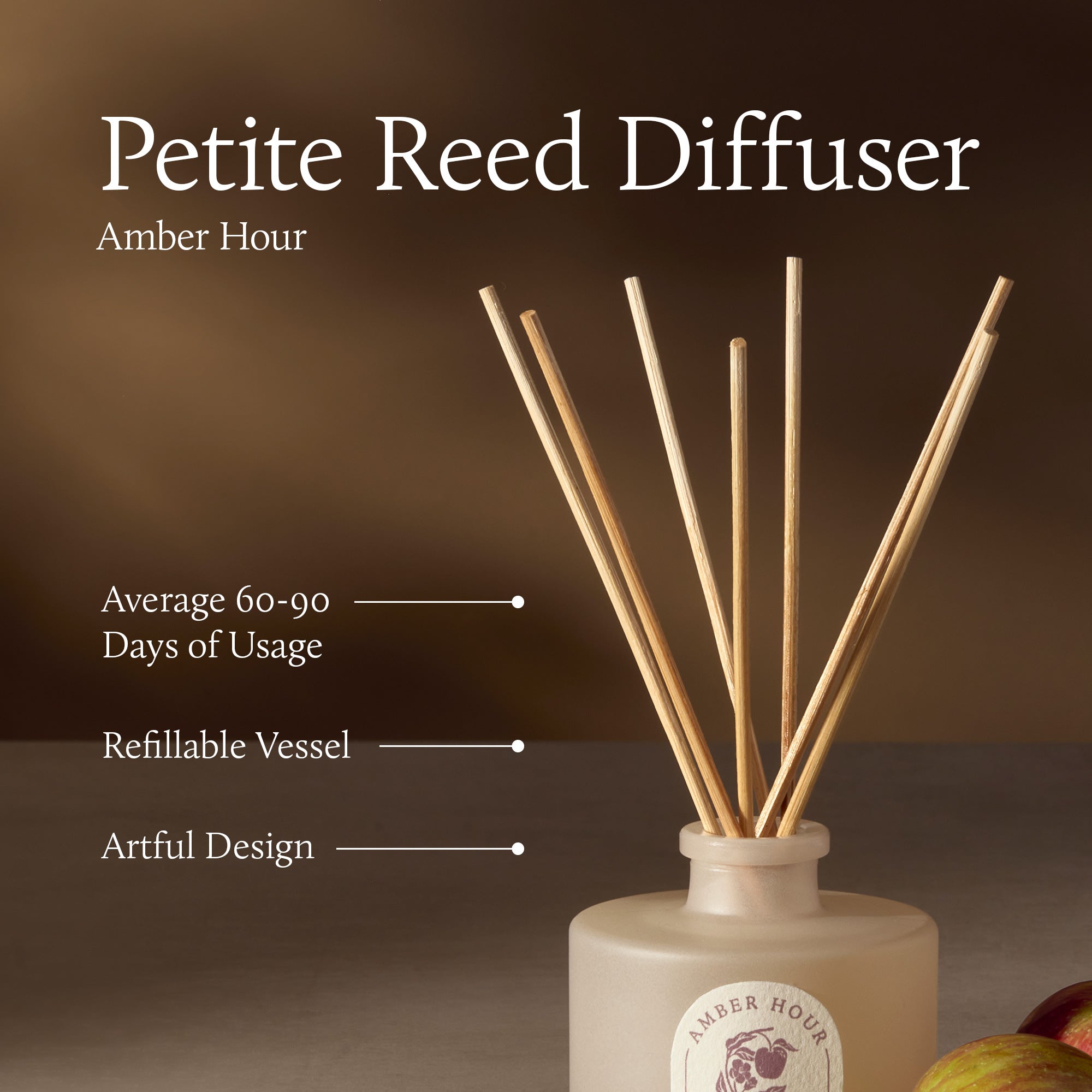 Petite Reed Diffuser with wooden sticks in a white container on a brown background