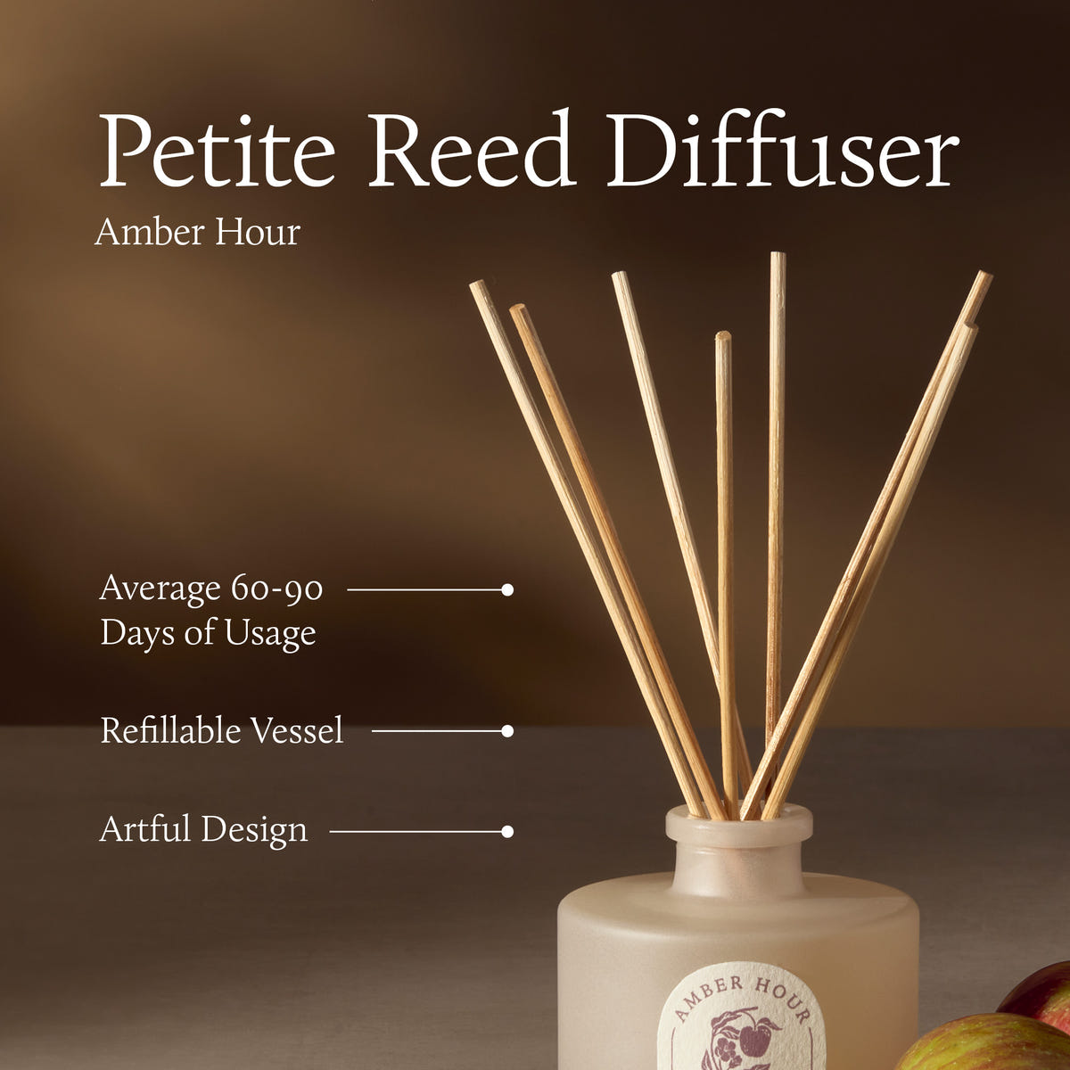 Petite Reed Diffuser with wooden sticks in a white container on a brown background