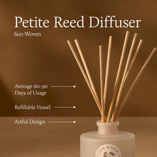 Petite Reed Diffuser with wooden sticks in a white container on a brown background