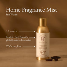 Gold bottle of Thymes Home Fragrance Mist on a brown background