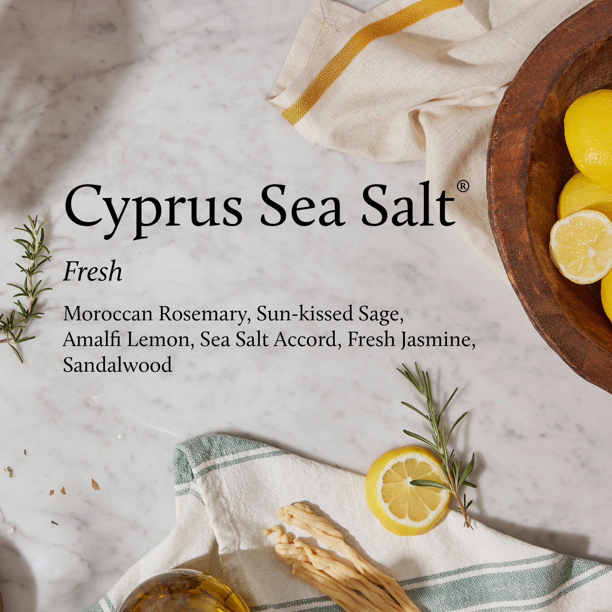 Advertisement for Cyprus Sea Salt with lemons, rosemary, and sage on a marble surface.