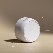White cylindrical device with 'pura' branding, shown with dimensions on a beige background