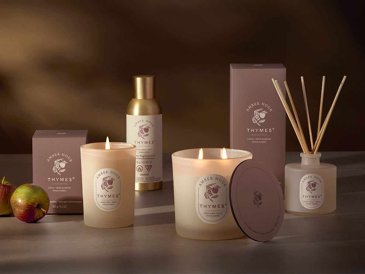 Thymes candle and diffuser set on a dark background