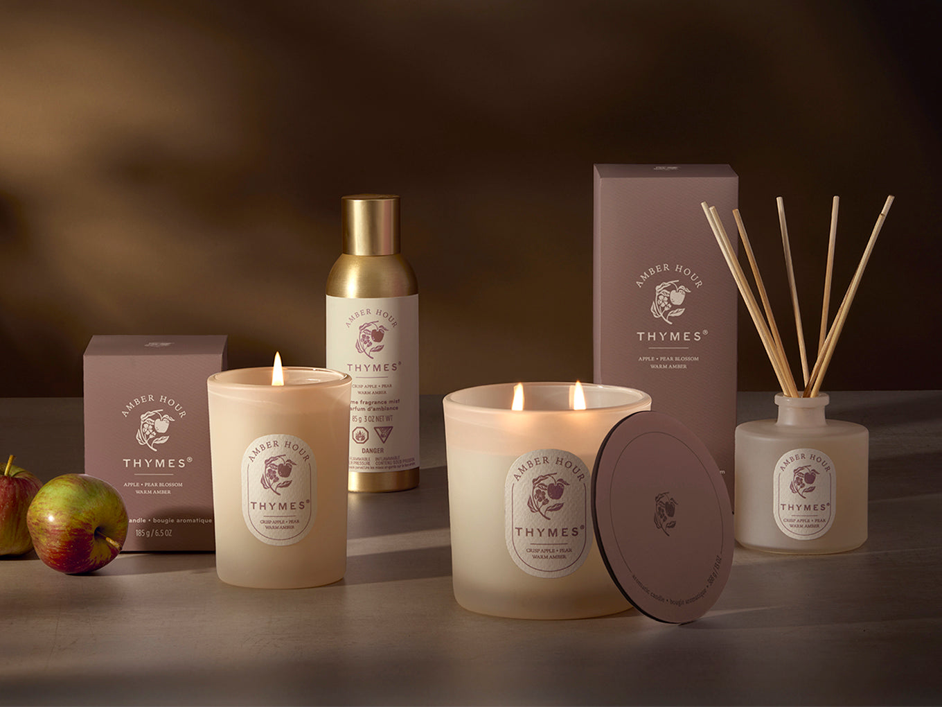 Thymes candle and diffuser set on a dark background