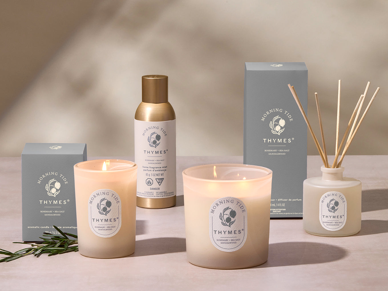Thymes candle and diffuser set on a neutral background