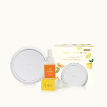 Outo diffuser with essential oil bottle and packaging on a white background