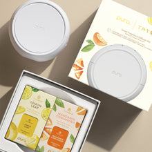 Puro smart fragrance diffuser set with lemon leaf and mandarin coriander scents on a beige background