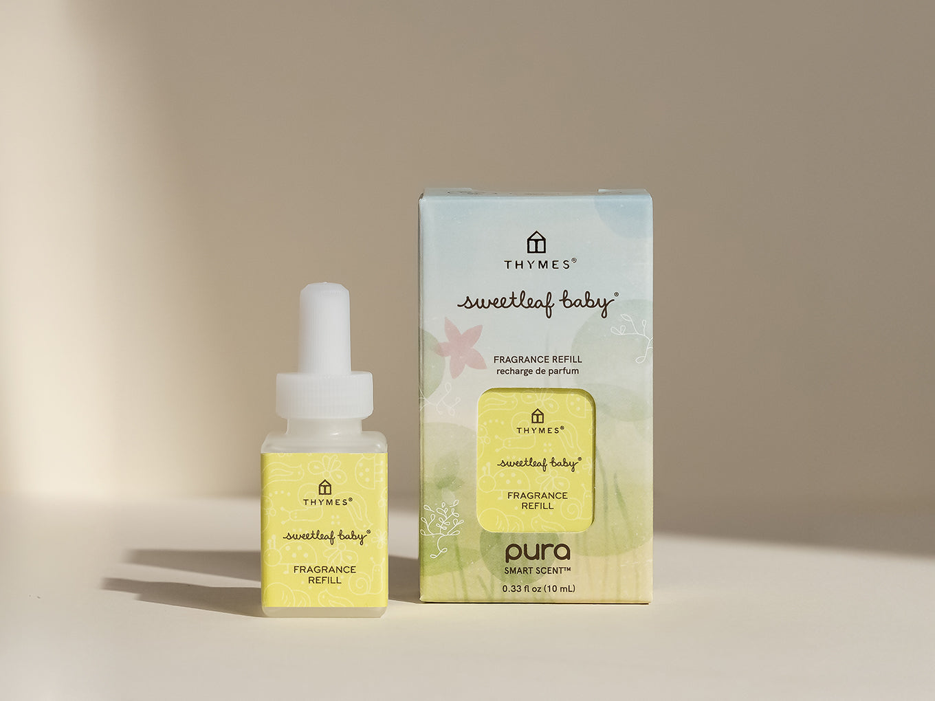 Thymes sweetleaf baby fragrance refill bottle and packaging on a beige background