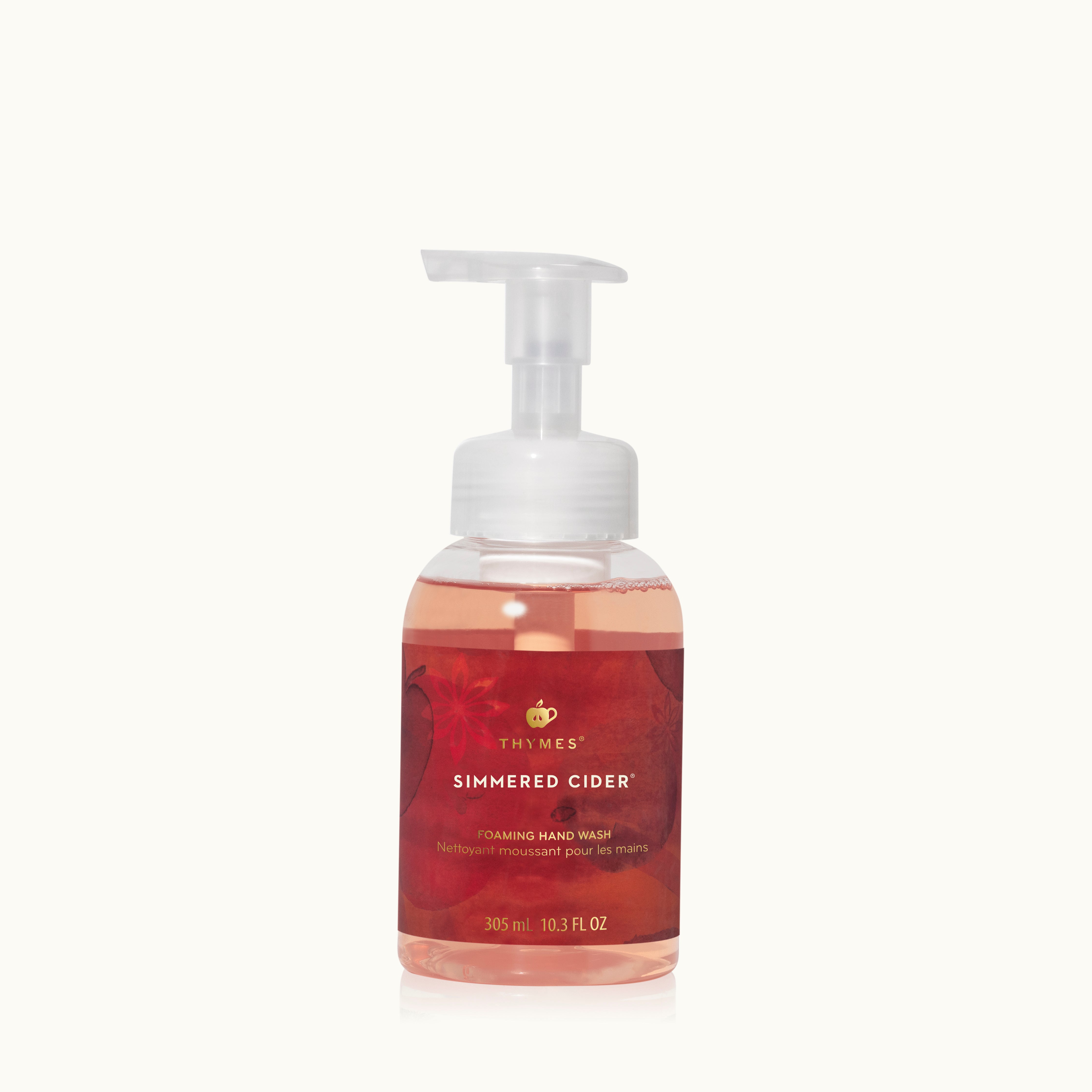 Foaming hand wash bottle labeled 'Simmered Cider' by Thymes on a white background