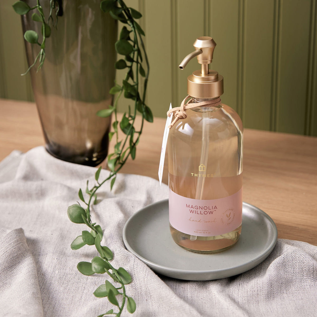 Alternate image of Thymes Magnolia Willow Large Hand Wash on a table