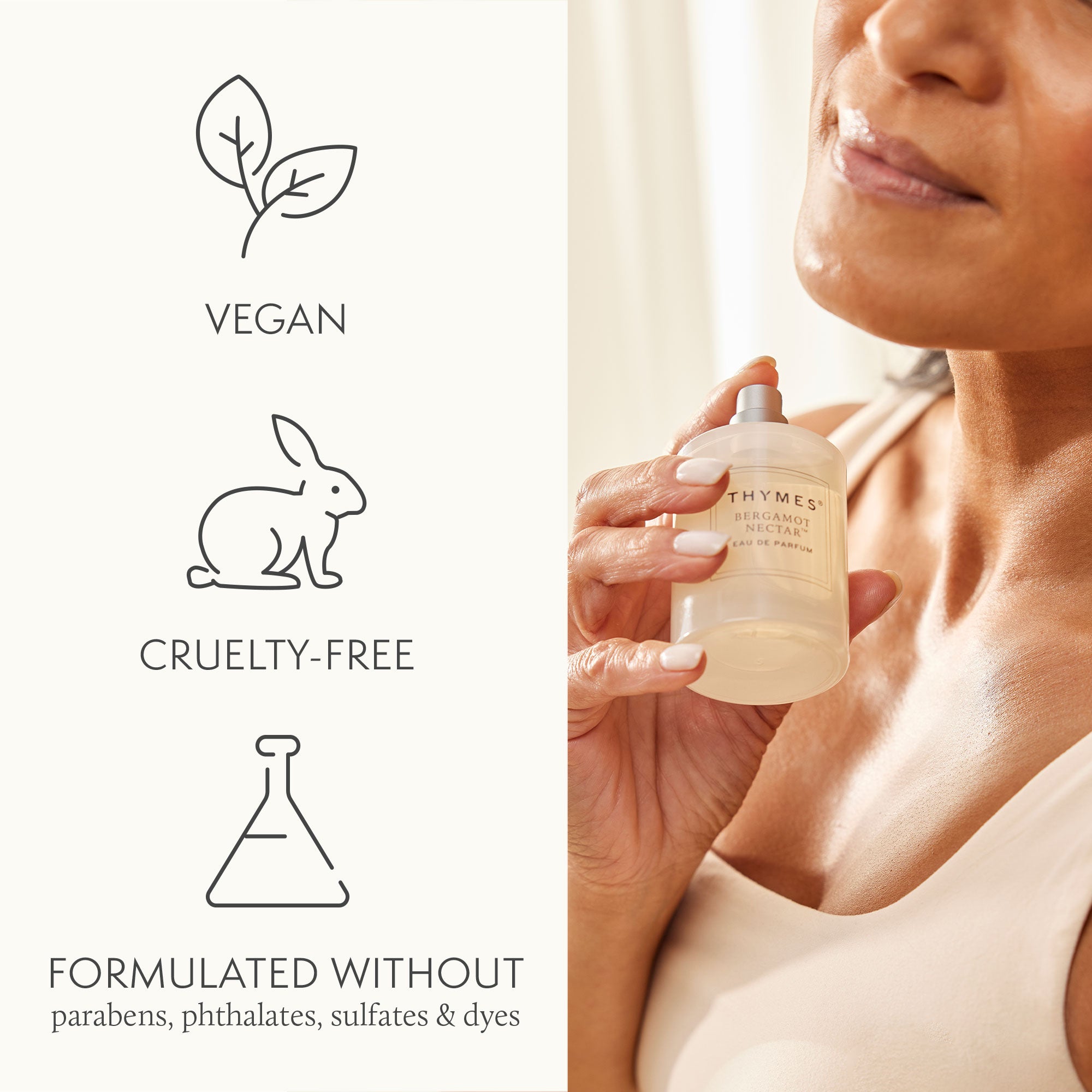 Woman holding a Thymes Eau de Parfum with vegan, cruelty-free, and sulfate-free icons on the left.