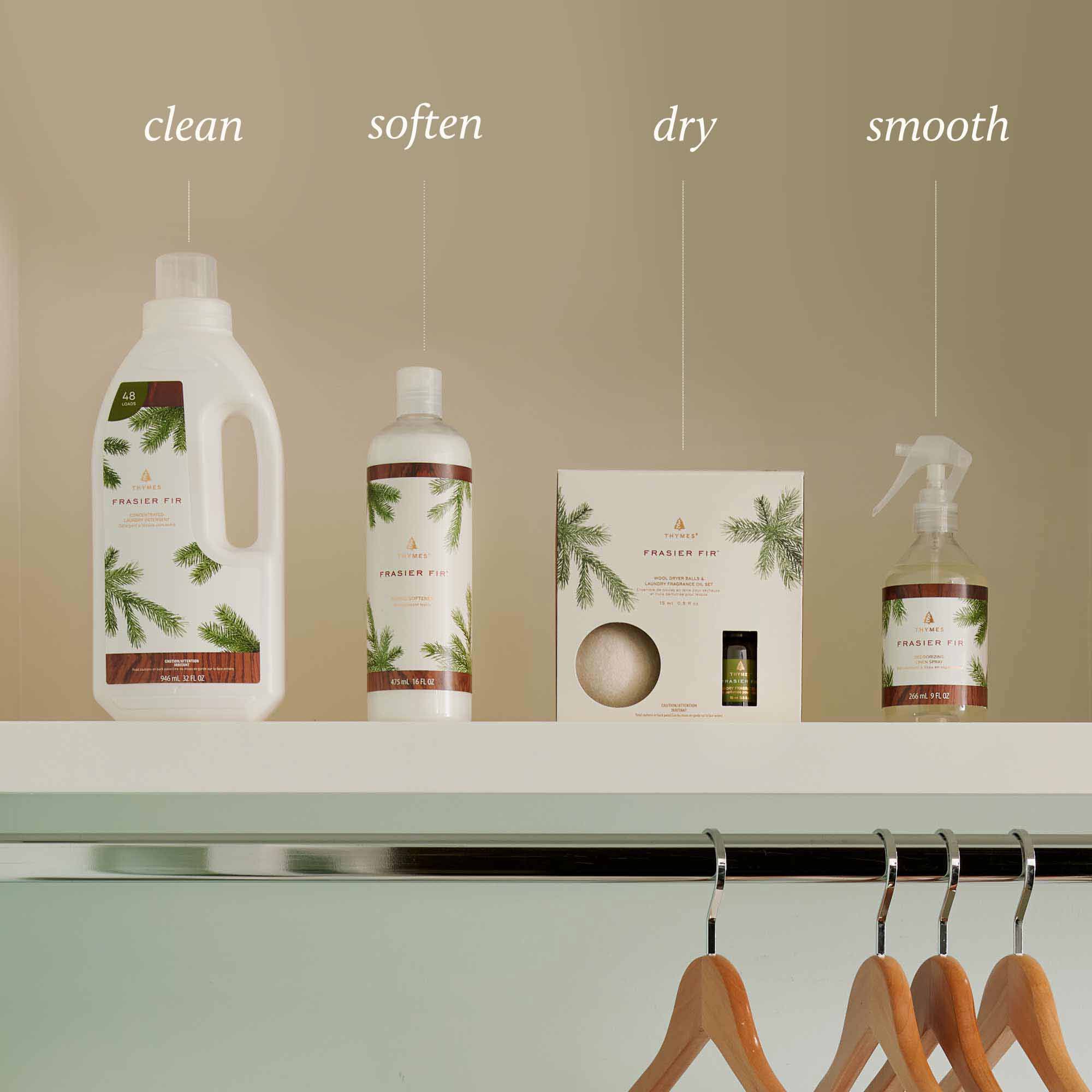 Thymes Frasier Fir Laundry Products Labeled Clean, Soften, Dry, Smooth