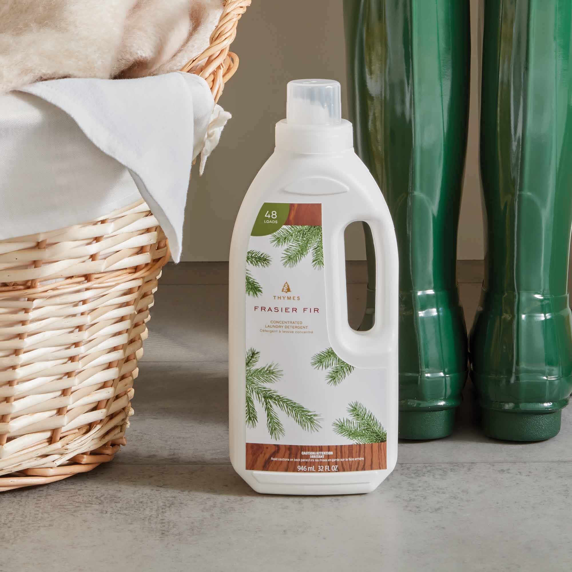 Thymes Frasier Fir Concentrated Laundry Detergent Next to Basket