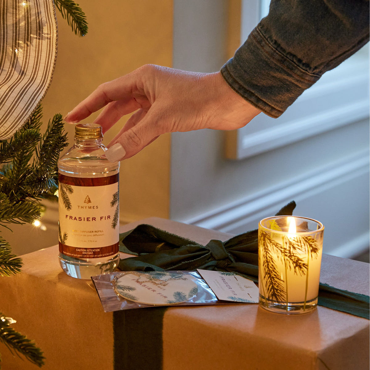 Alternate image of Thymes Frasier Fir Reed Diffuser Oil Refill Beside Candle and Sachet