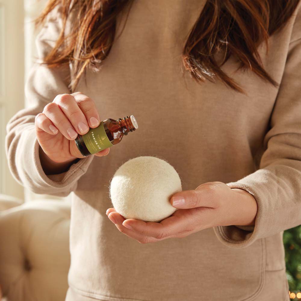 Alternate image of Frasier Fir Wool Dryer Balls & Laundry Fragrance Oil fragrance oil being applied to wool dryer ball