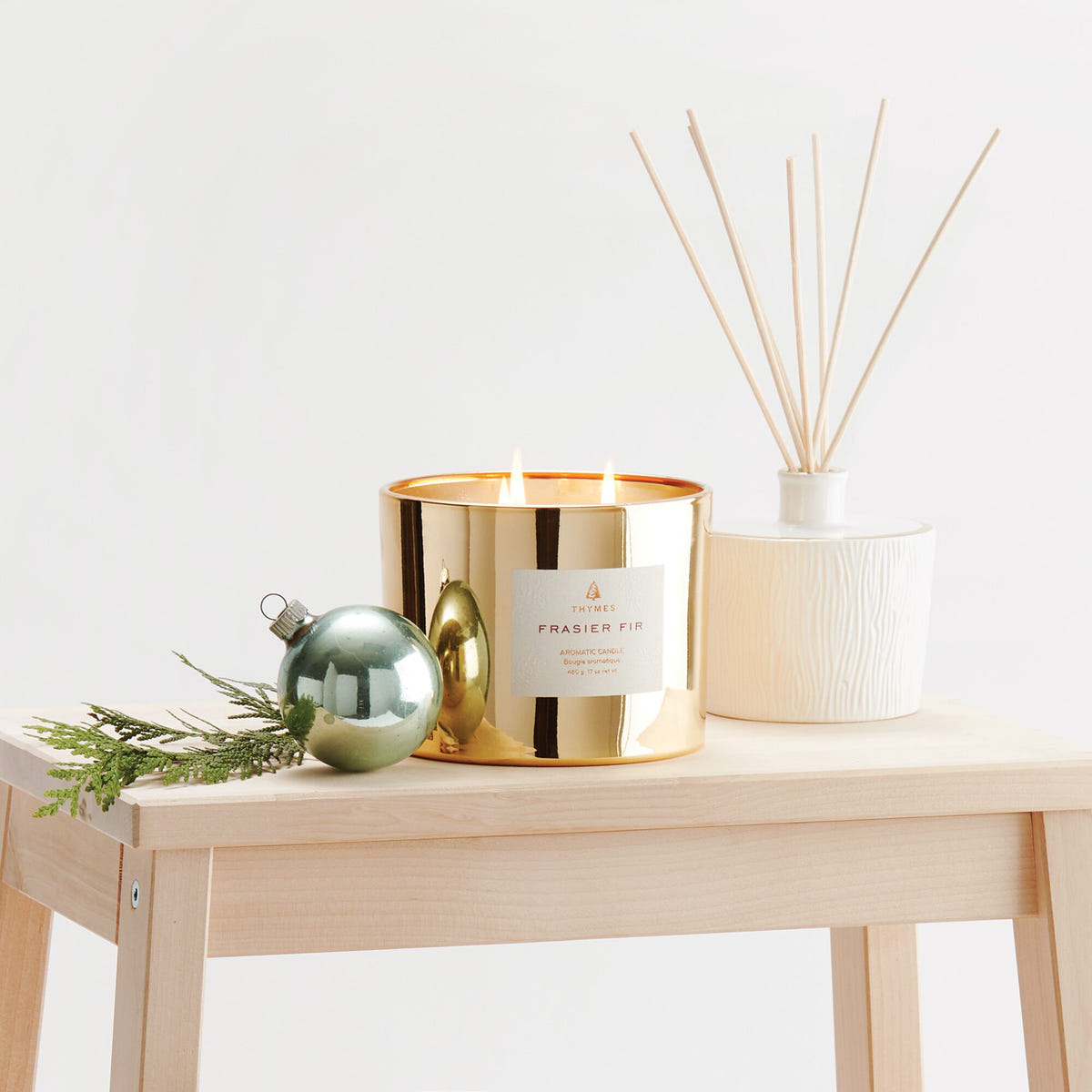 Alternate image of Frasier Fir Gold 3-Wick Candle Lit on Display
