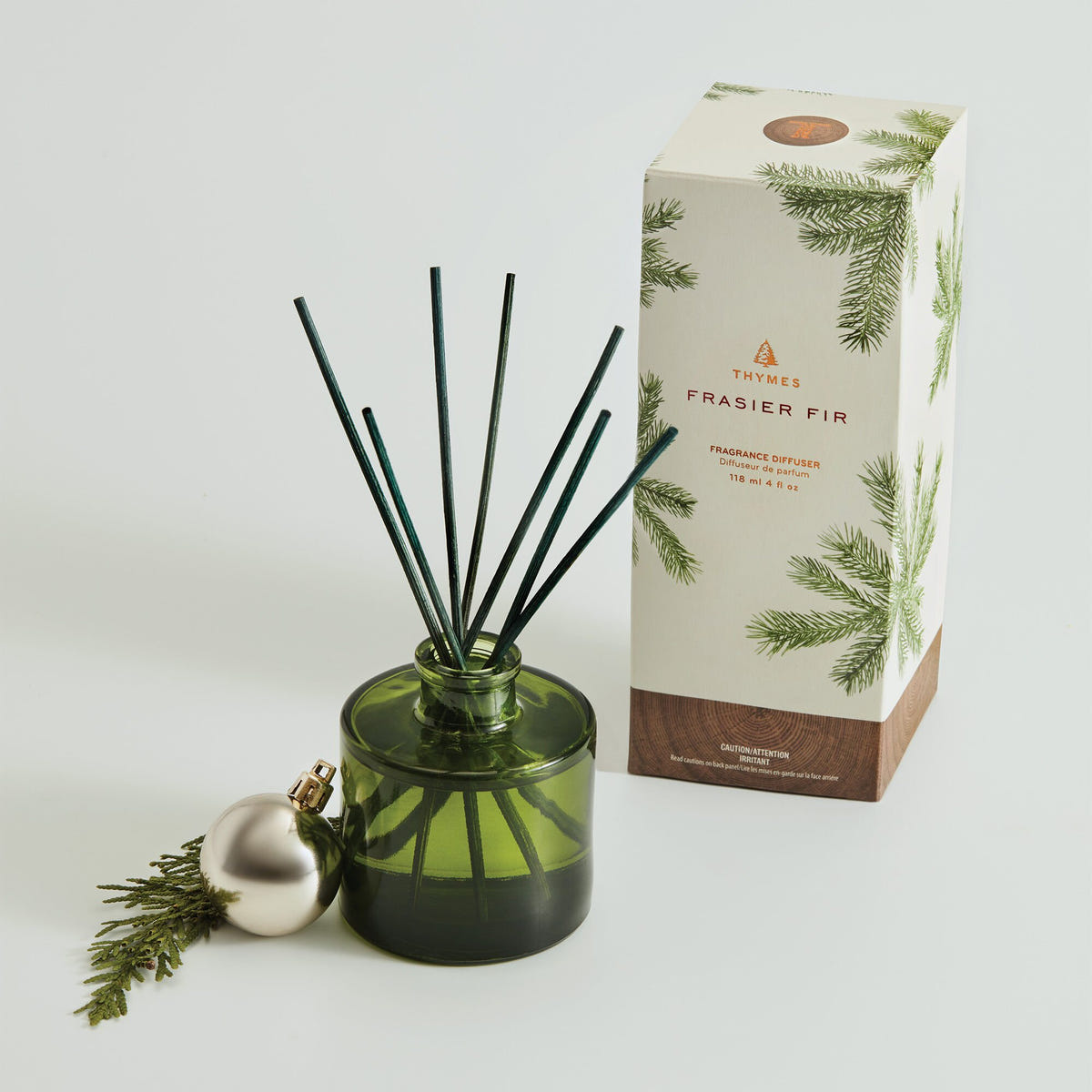 Alternate image of Frasier Fir Petite Reed Diffuser next to Packaging