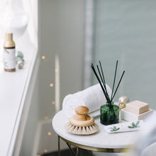 Thymes Frasier Fir Green Reed Diffuser on Bathroom Table