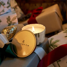 Thymes Frasier Fir Candle Tin with Gold Lid on Wrapped Gifts