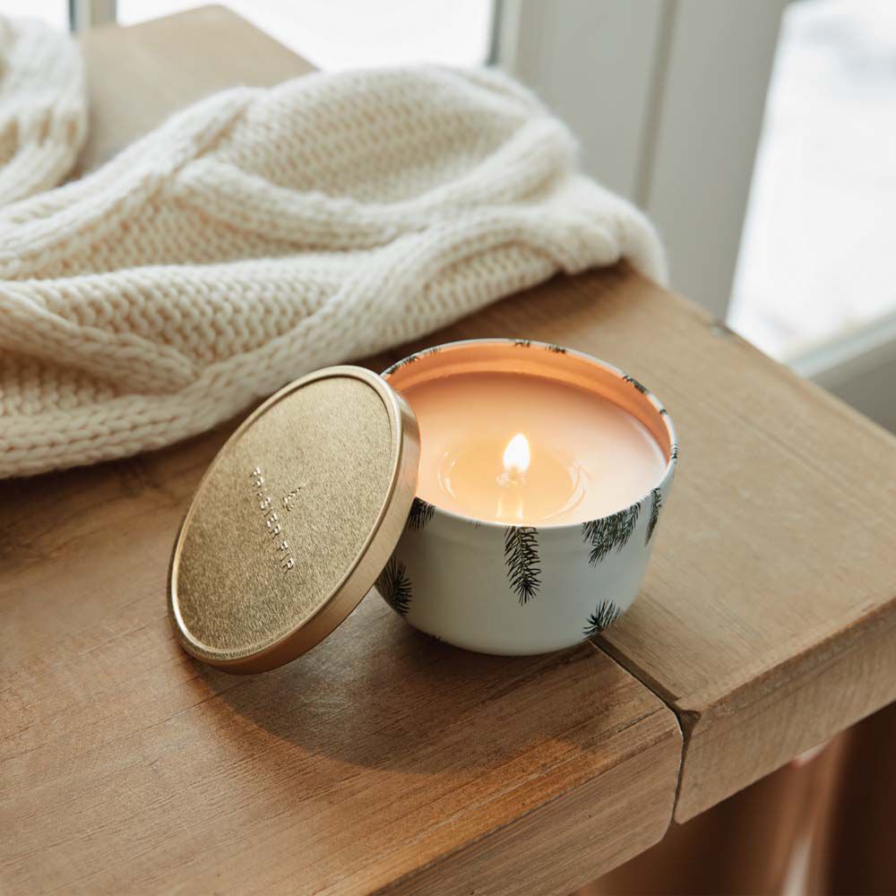 Alternate image of Thymes Frasier Fir Candle Tin with Gold Lid is a Christmas Candle burning