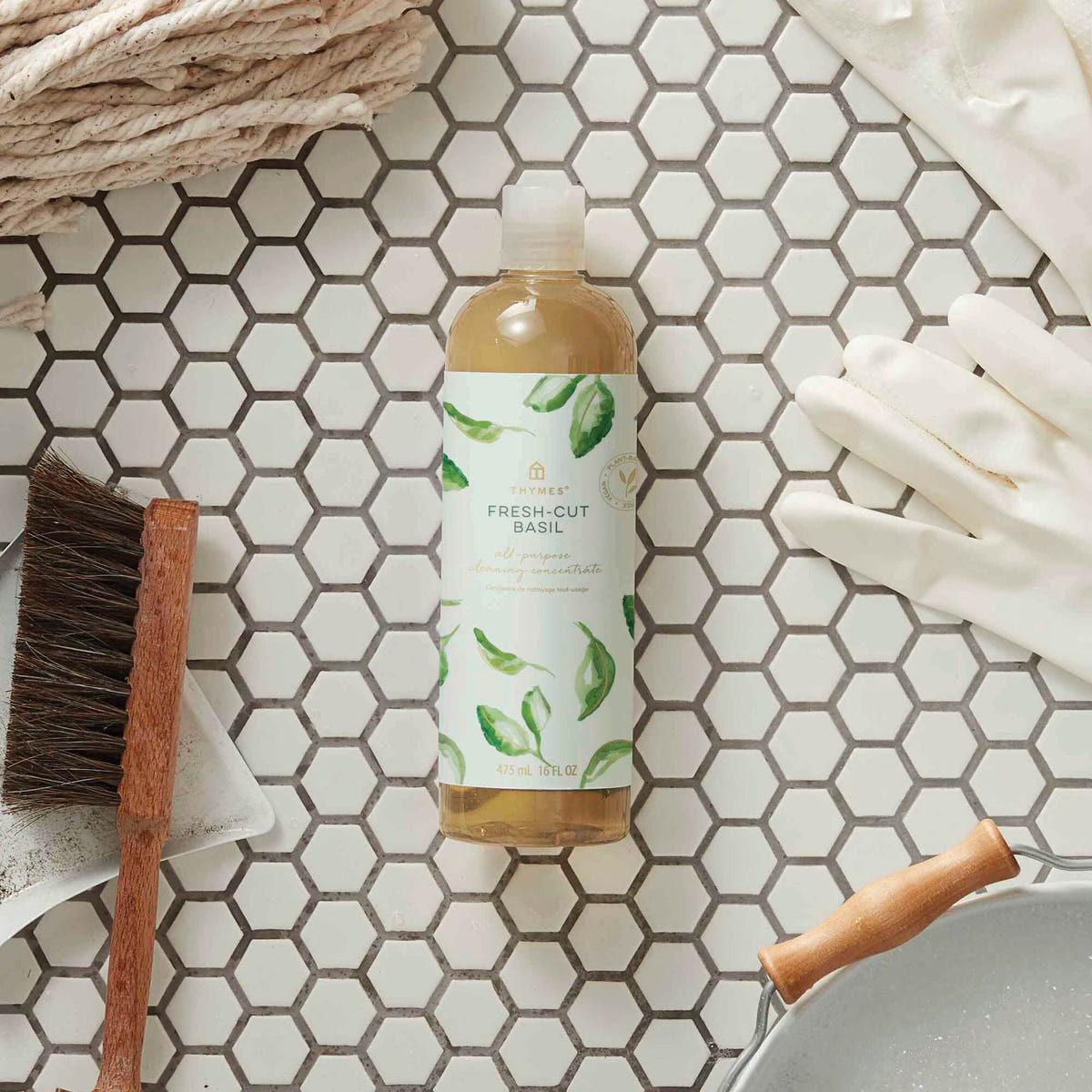 Alternate image of Thymes Fresh-Cut Basil All-Purpose Cleaning Concentrate for Floors and Surfaces laying on bathroom tile