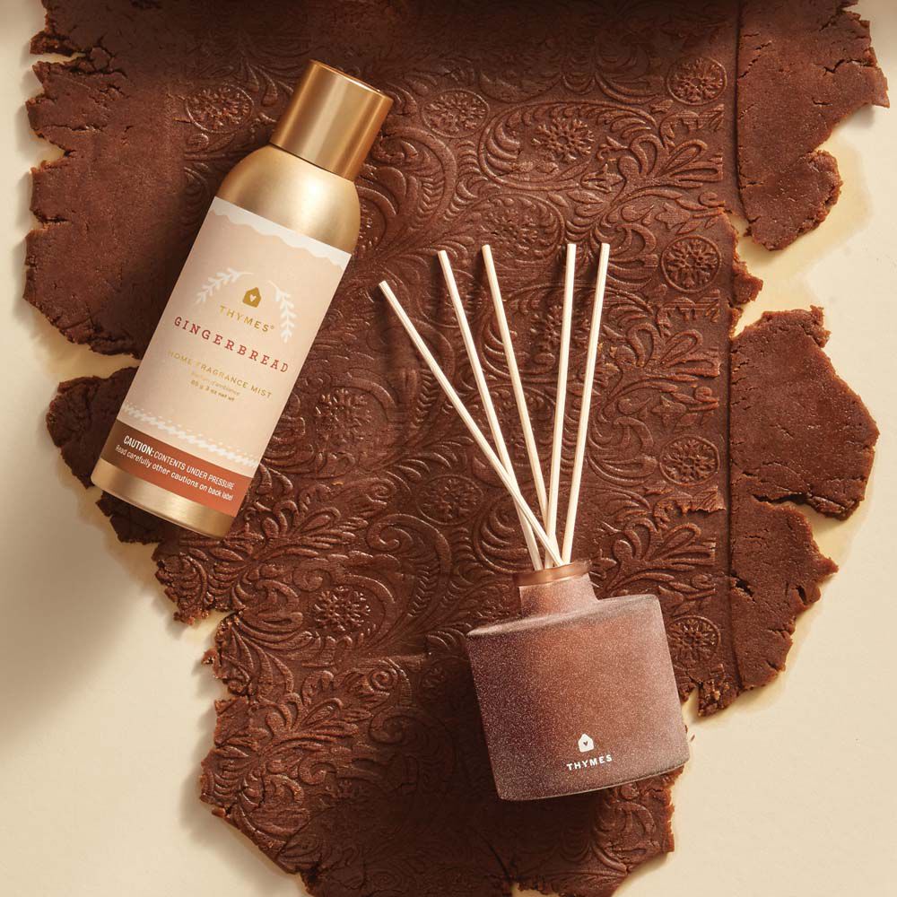 Alternate image of Thymes Gingerbread Petite Reed Diffuser is a Holiday Fragrance with gingerbread dough background