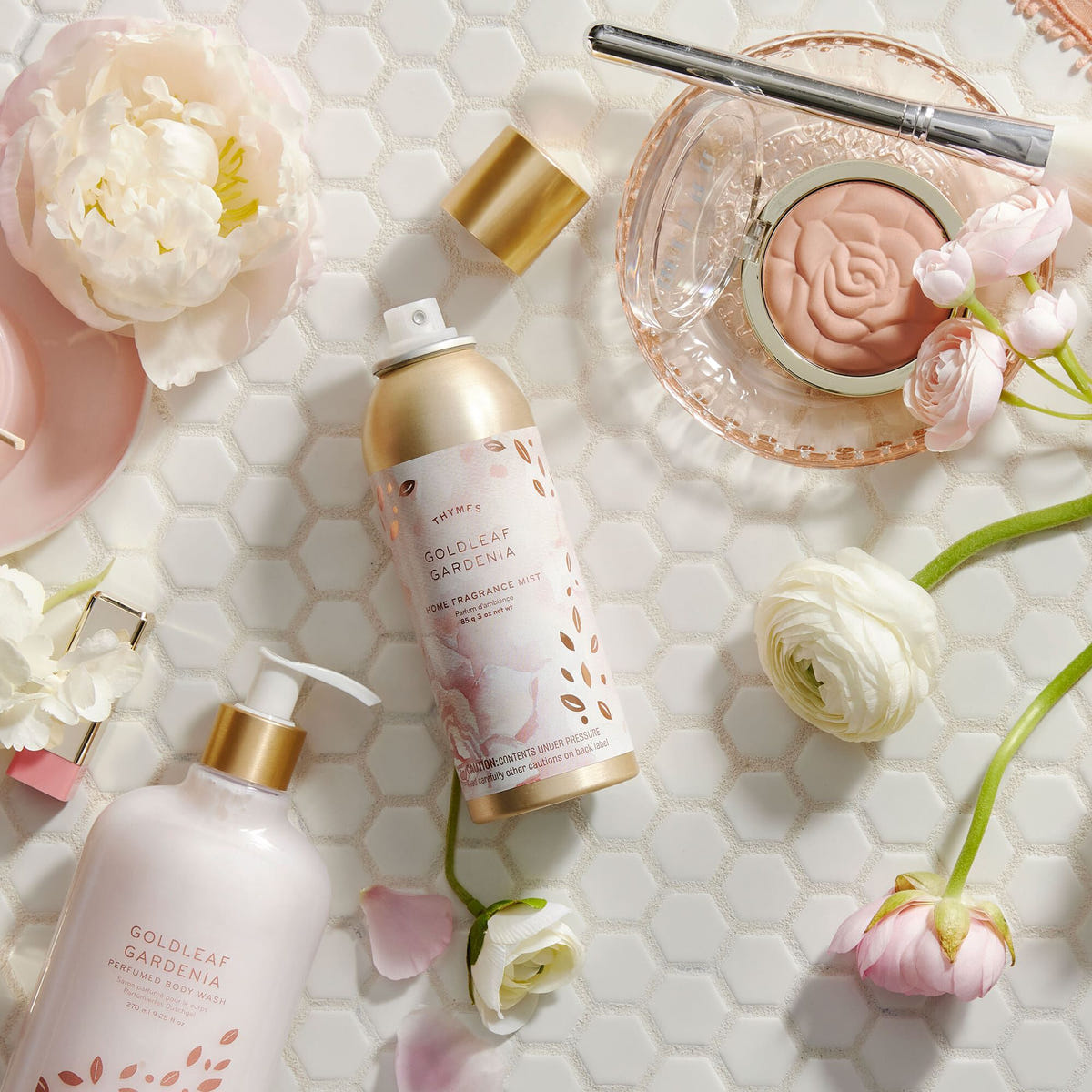 Alternate image of Thymes Goldleaf Gardenia Home Fragrance Mist on bathroom counter with flowers