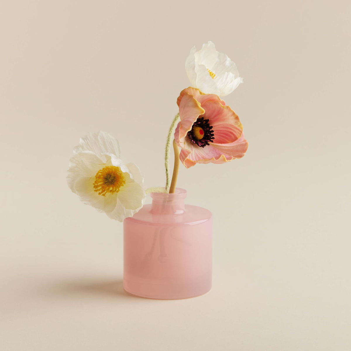 Alternate image of Thymes Goldleaf Gardenia Petite Reed Diffuser vessel filled with flowers