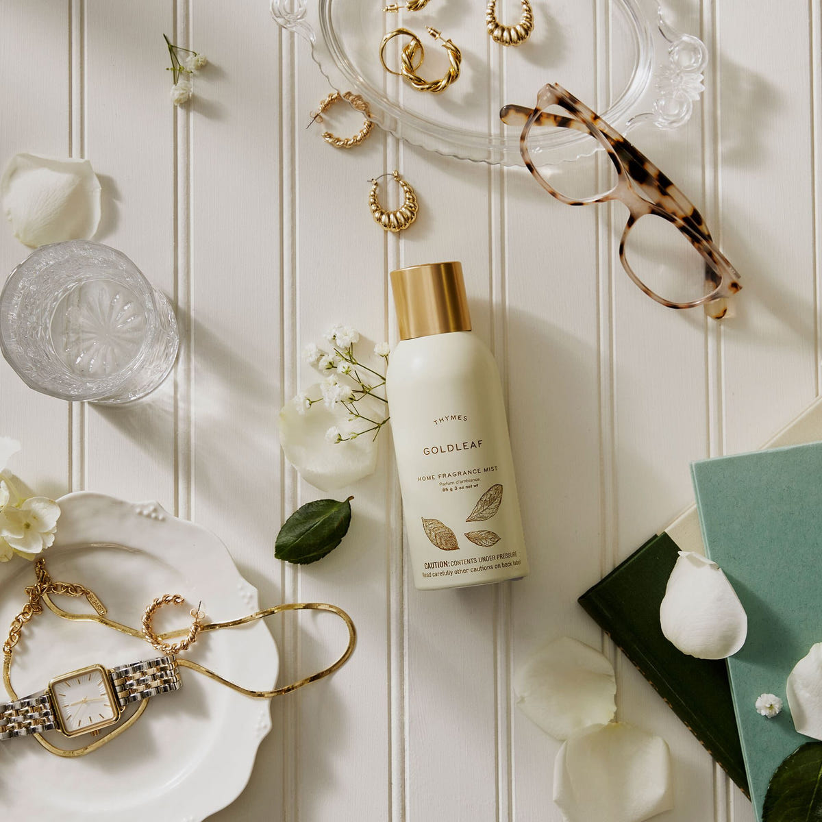 Alternate image of Thymes Goldleaf Home Fragrance Mist surrounded by flowers