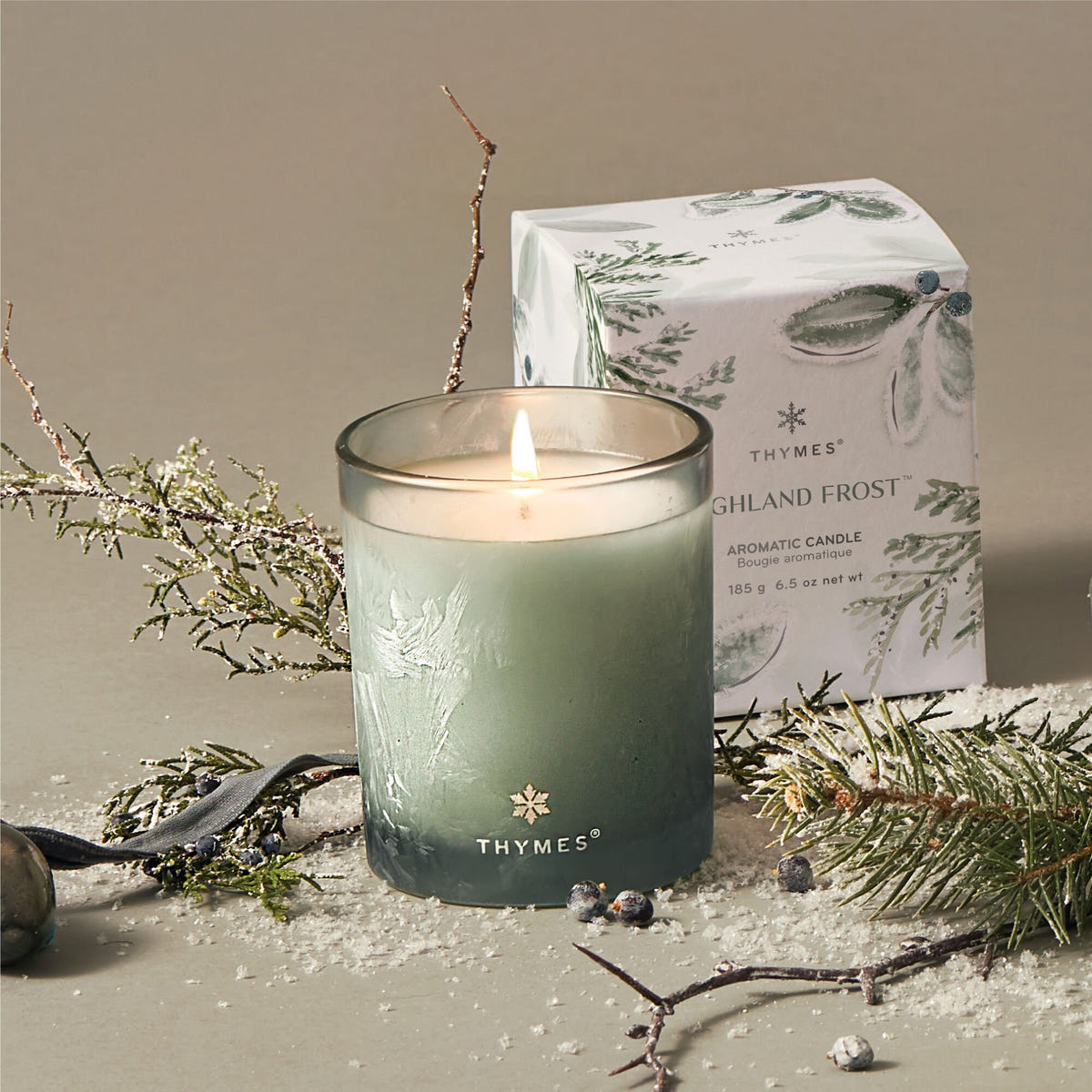 Alternate image of Thymes Highland Frost Boxed Votive Candle with box and styled